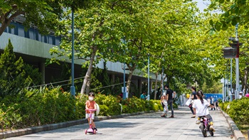 Kids enjoy cycling on the generous pathways.